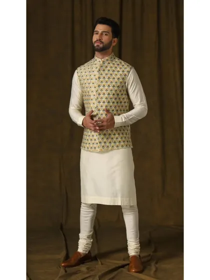 The Lemon Bandi & Ivory Kurta Ensemble. The vibrant lemon bandi features intricate floral embroidery, creating a look of playful charm and timeless elegance.