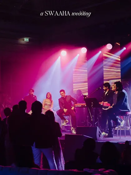A live band performance on stage, with the couple joining the artists for an intimate, unplugged session, creating a personal and memorable musical moment.