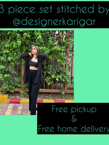 A stylish three-piece co-ord set in black, stitched by us. This includes a crop top, wide-leg pants, and a matching shirt, available with free pickup and delivery.