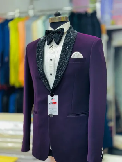 Another view of the purple tuxedo with the black sequined lapel, showing the sharp tailoring and modern fit.