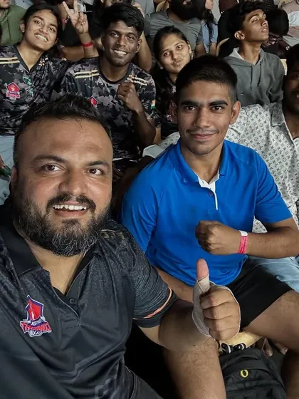 Me taking a selfie with the team in the audience, cheering on our fighters. We are each other's biggest supporters, both inside and outside the cage.