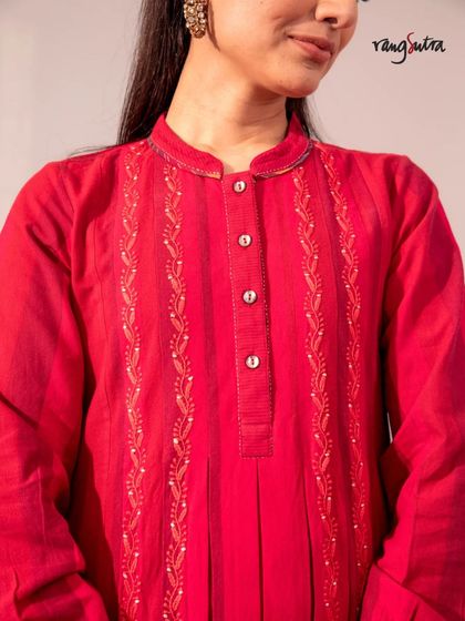A close-up of the Chikankari embroidery on our red Haveli dress. The tone-on-tone stitching creates a subtle, elegant texture that is both traditional and modern.