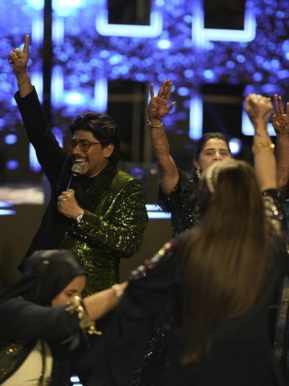 The grand finale of a Sangeet night, with everyone on stage celebrating together. This is the kind of joyful chaos I love to create.