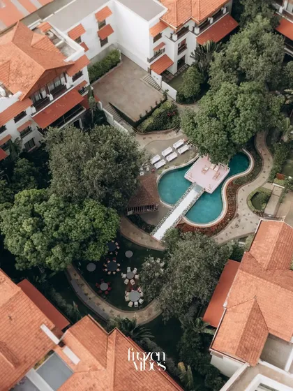 A top-down drone shot of the Rhythm Lonavala resort. This perspective reveals the beautiful layout and architecture of the wedding venue.