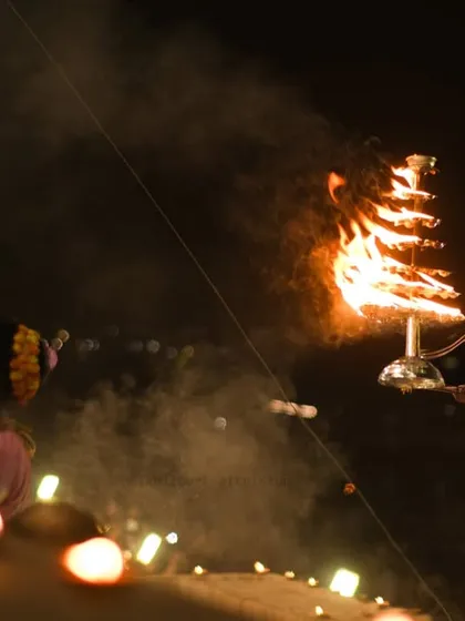 The Ganga Aarti in Banaras is pure emotion. This shot focuses on a priest performing the ritual with a multi-tiered fire lamp, capturing the devotion and spiritual intensity of the ceremony.