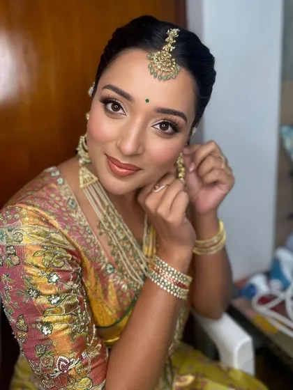A closer look at the final touches. Her skin looks luminous and fresh, a signature of my bridal style, ensuring she looks perfect from every angle.