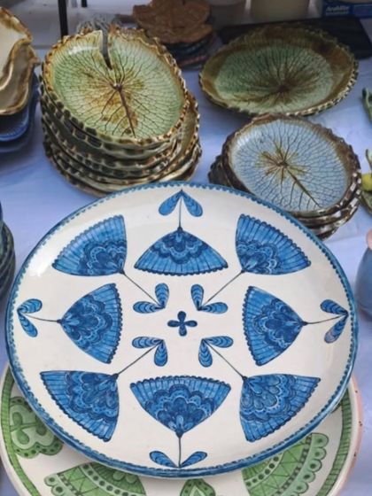 A beautiful blue patterned plate sitting amongst my other serveware at the Delhi Potter's Market. I love creating large, statement serving platters like this one.