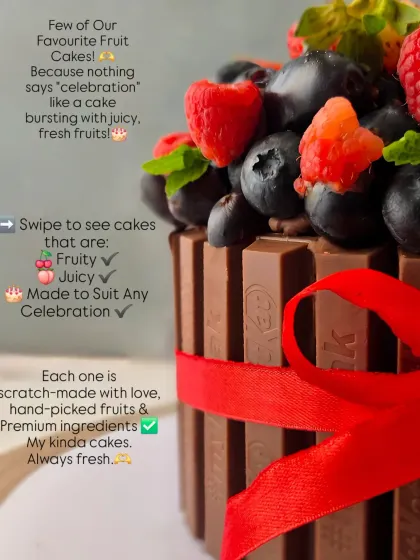 A close-up of a KitKat cake, showcasing the abundance of fresh berries on top. I believe in using hand-picked fruits for the best taste.