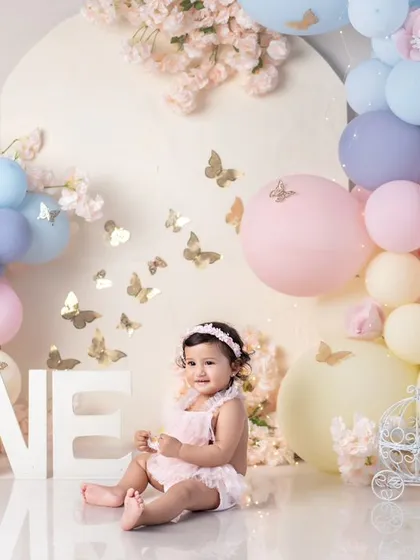 A wide view of the beautiful pastel butterfly setup, with the "ONE" letters prominently displayed.