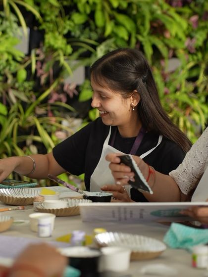 A smiling participant at the Meesho Fempower event. Our goal is to create positive and empowering experiences through art.