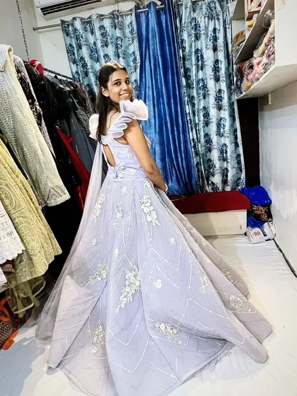 A side view of the lavender gown, showing the beautiful trail and the detailed work on the bodice. I love creating pieces that look stunning from every angle.