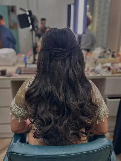 Another shot of the soft and natural half-updo, a perfect 'no-fuss' party look.