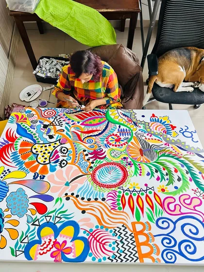 An overhead shot of me lost in the world of my painting, with my dog Bingo chilling on my office chair. This is my happy place.