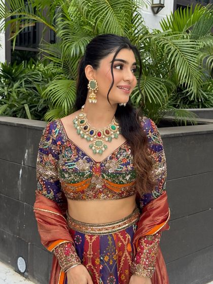 A side profile showcasing the beautiful hairstyle and the radiant glow of her skin.