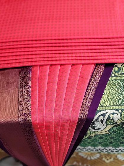 The process of creating the pleats before they are folded.