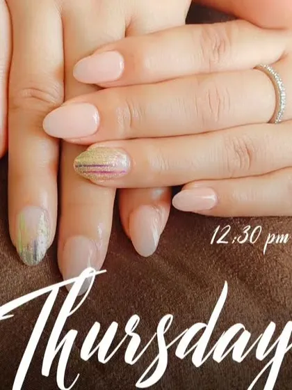 Another view of the nude nails with holographic foil accents, showing how they look with an engagement ring.