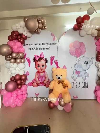 A fun "New Boss in Town" theme for a baby girl. This setup uses bright pink and rose gold balloons, personalized backdrops, and "BABY" blocks for a playful announcement.