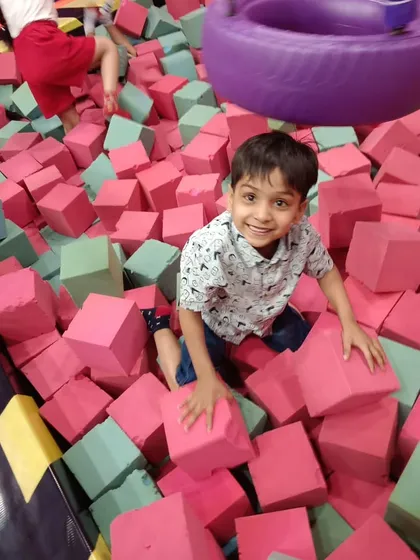 Look at that happy face. Our soft foam pit is perfect for kids who love to jump, tumble, and land softly. It's a great way for them to burn off energy and build confidence in a cushioned, safe space.