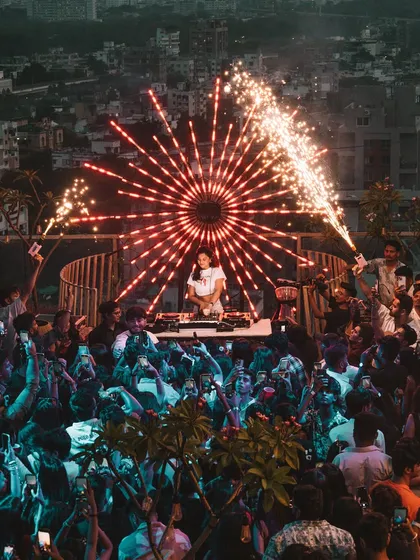 Another look at the incredible sundowner party in Nagpur. The combination of a rooftop setting, a massive crowd, and epic pyrotechnics creates an unforgettable festival DJ experience.
