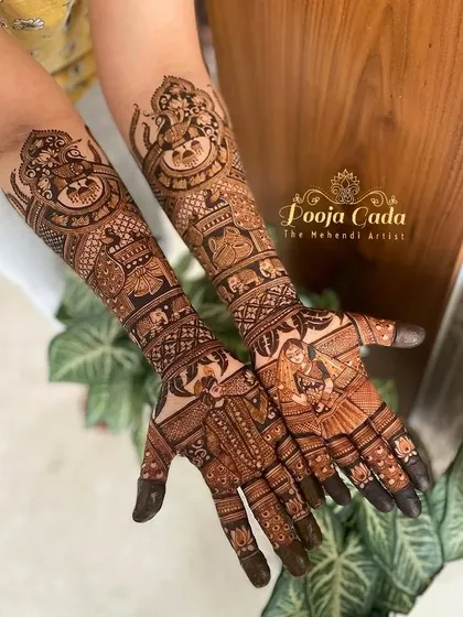 A beautiful bridal design featuring portraits of the bride and groom, along with a depiction of Lord Ganesha for blessings.