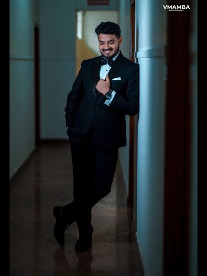 A duplicate of 14, a classic and dapper groom portrait.