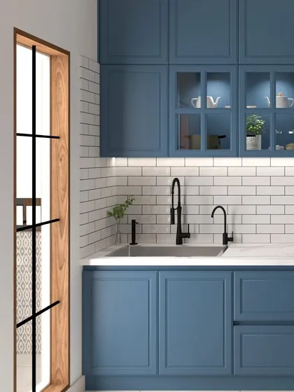 For those who love timeless design, this kitchen features classic shaker-style cabinetry in a deep blue, paired with a clean white subway tile backsplash. The black fixtures and fittings add a touch of modern contrast to this elegant space.
