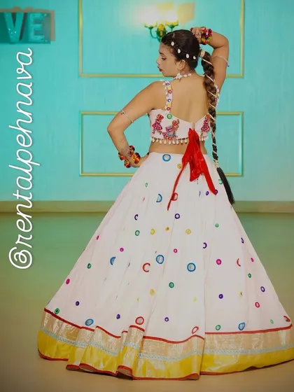 Another angle of the white Garba lehenga, a fun and vibrant choice for dandiya nights.