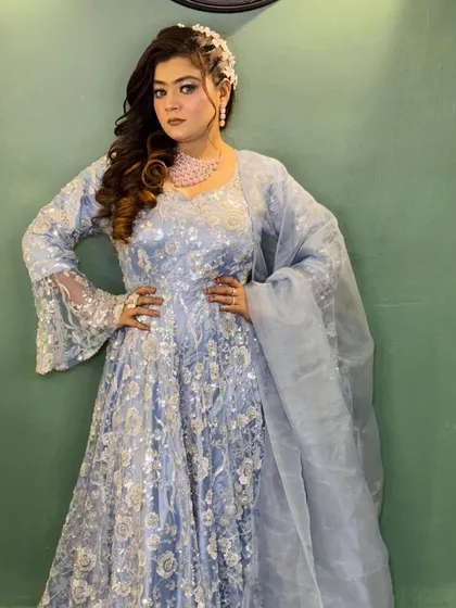A full-length pose showcasing the entire ensemble. The soft glam makeup ensures the client looks polished and put-together from head to toe.