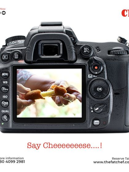 Say Cheeeese! A fun shot capturing the cheesy goodness of our food, because every meal should make you smile.