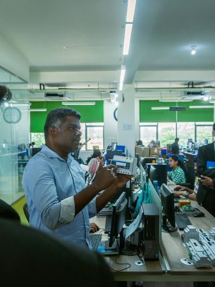 A close-up shot of a product demonstration, where I explain the technical details of my devices to future business leaders.