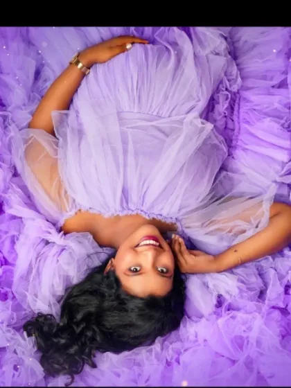 A creative overhead shot shows the beautiful expanse of our lavender ruffled gown, creating a dreamy sea of purple.