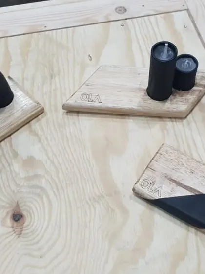 A collection of the finished desk accessories we created for the Ola Electric team. Each one is a unique piece of their company's story, handcrafted from their own industrial waste.