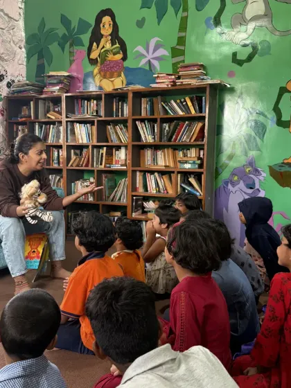A volunteer uses a lion puppet to tell the story of "The Lion Who Wanted to Love" at our Jungle Book Library. Puppets are a wonderful tool to capture the children's attention and make the characters feel real and relatable.