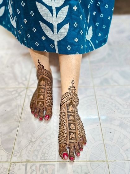 A full-coverage lotus grid pattern for the feet, matching an intricate bridal hand design.