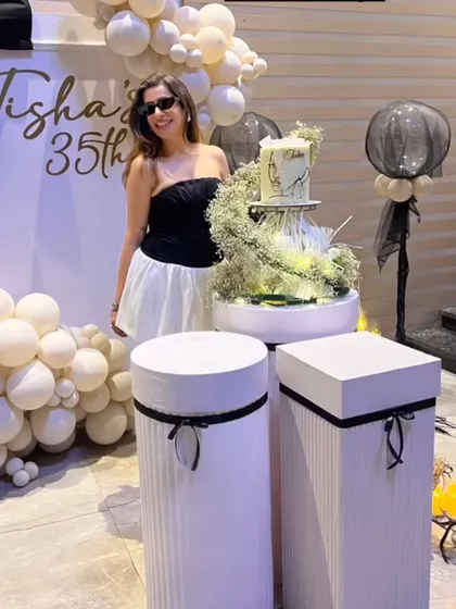 The birthday girl enjoying her chic, bow themed 35th birthday party. Our goal is always to create a backdrop and atmosphere that makes the host feel celebrated and special.
