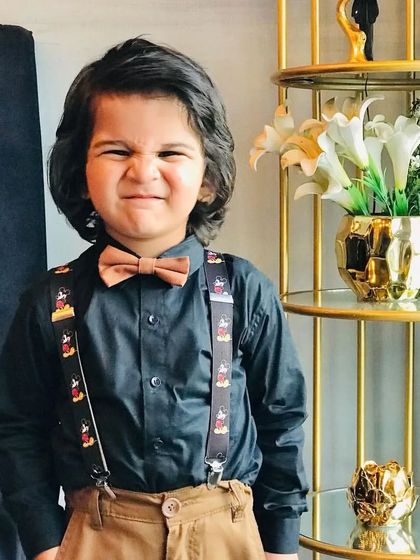 It's all about personality. This young model shows off his fun side, giving a great expression that brings the whole styled look to life.