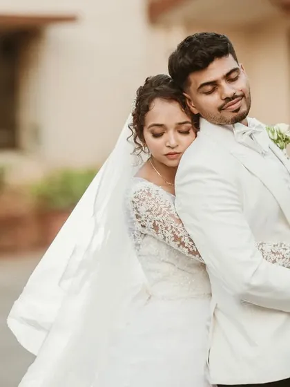 A peaceful, tender embrace. This portrait captures a moment of quiet comfort and affection, showing the deep connection between the couple.