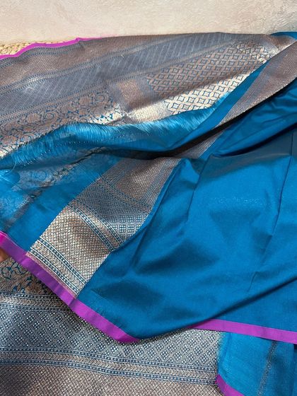 A look at the plain teal blouse piece with a magenta border, showing the beautiful texture of the silk.