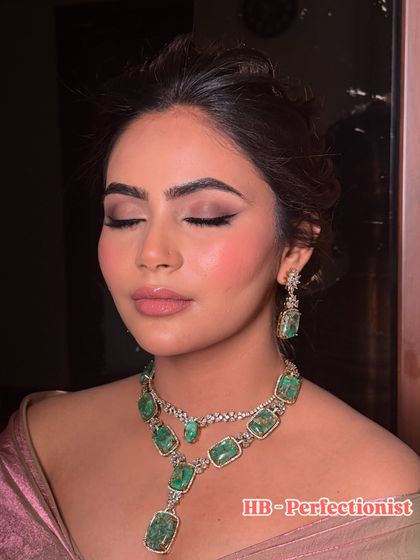 Another angle of this stunning eye makeup, showing the seamless blend of shadows. The lip color is a perfect nude pink, balancing the dramatic eyes.