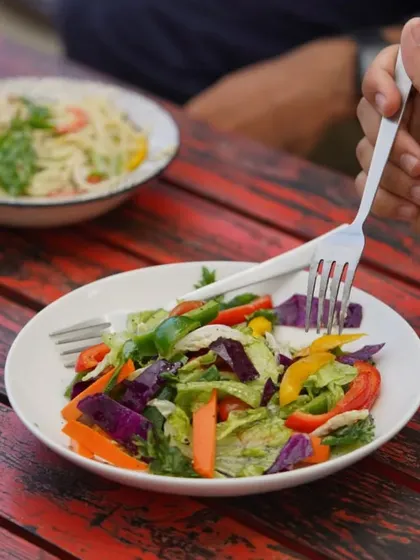 A plate full of colors to celebrate any day. Our fresh garden salad is a vibrant mix of crisp vegetables, perfect for a light and healthy meal.
