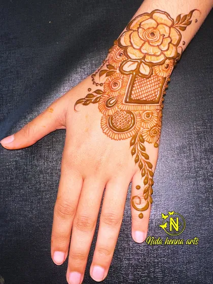 A view of the Eid special floral design from the side. This angle shows how the pattern elegantly wraps around the wrist.