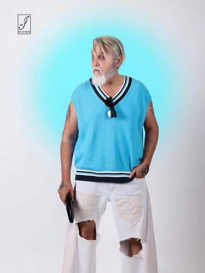 A profile shot from the same series, capturing a thoughtful expression and the stylish combination of colors and textures.