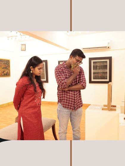 A couple contemplates a piece, showcasing the thoughtful curiosity our exhibitions inspire.
