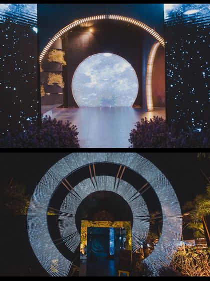 The sangeet entrance, designed as a portal with a massive circular LED screen depicting the moon, creating a powerful and immersive first impression.