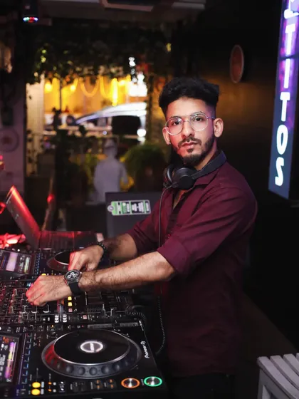 A throwback shot of me at the DJ console at Tito's. My style has evolved, but my commitment to delivering a great performance has always been the same.