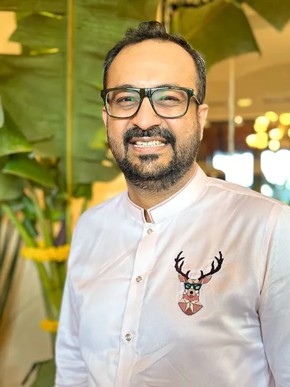 A close-up of the quirky and majestic stag motif, complete with glasses. This is how we translate your personality into wearable art.