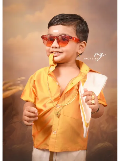A close-up full of personality. This little star is ready for his close-up during his South Indian themed birthday shoot.
