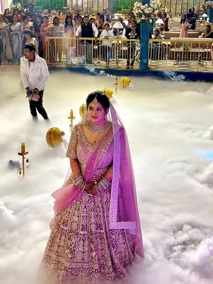 I make sure the bridal entry is a showstopper. Here, I used a fog machine and decorative matkas to create a dreamy, cloud-like path for the bride, making her entrance truly unforgettable.