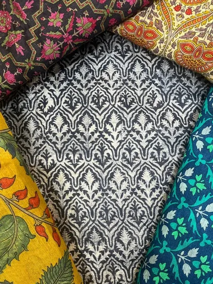 The foundation of our bespoke service is an extensive collection of the finest fabrics, allowing you to choose the perfect texture and print for your custom creation.