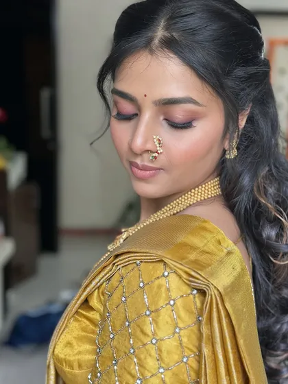 A close-up of Dr. Divyanka's engagement look, featuring soft pink eyeshadow and glowing skin.